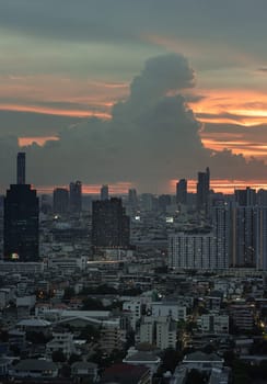 Bangkok, Thailand - 23 Aug 2024 - View of Beautiful Clouds in the Sky over Large Metropolitan City. Bangkok city skyscrapers after sunset with Dramatic sky background before Sunset, Space for text, Selective focus.