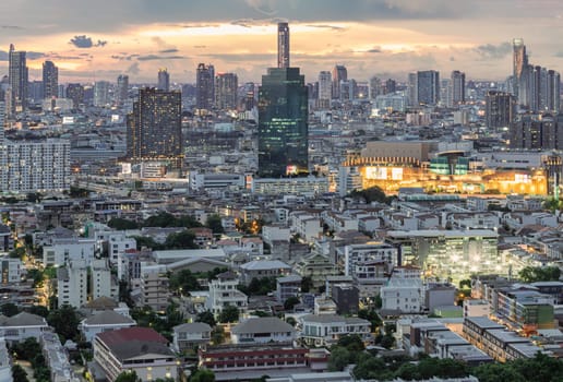 Bangkok, Thailand - 15 Aug 2024 - View of Beautiful Clouds in the Sky over Large Metropolitan City. Bangkok city skyscrapers after sunset with Dramatic sky background before Sunset, Space for text, Selective focus.
