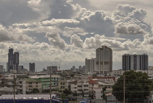 Bangkok, Thailand - 28 Aug 2024 - Amazing Clouds and Sky over Metropolitan City. Bangkok city skyscrapers at Afternoon with Dramatic sky background. use it as your wallpaper, poster and banner design, Selective focus.