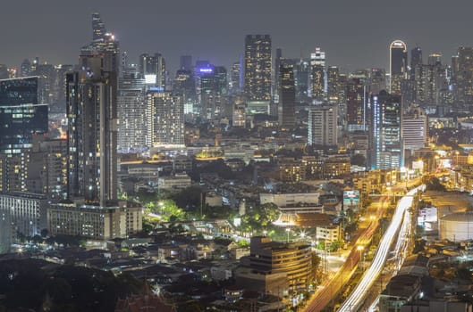 Bangkok, Thailand - 16 Sep, 2024 - Bangkok downtown cityscape in Business district with bright glowing lights at night. City night view of Bangkok city skyscrapers after sunset, Copy space, Selective focus.