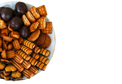 An inviting selection of various cookies and snacks is beautifully arranged on a plate, perfect for sharing during a cheerful afternoon gathering with friends or family.