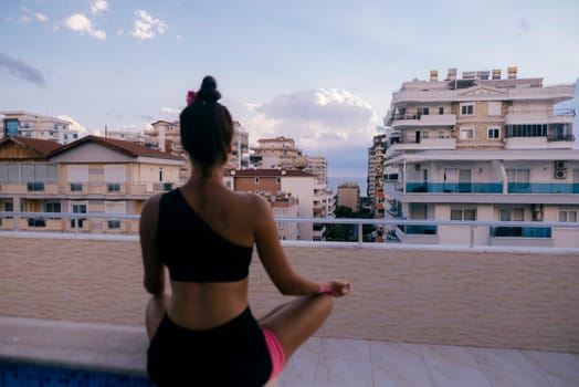 A serene figure meditating peacefully against a vibrant city backdrop, beautifully embodying tranquility and calmness