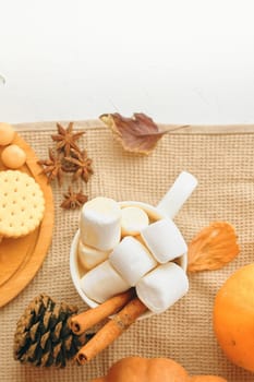 To create a warm and cozy autumn ambiance, decorate with fallthemed items and enjoy marshmallows for a festive touch