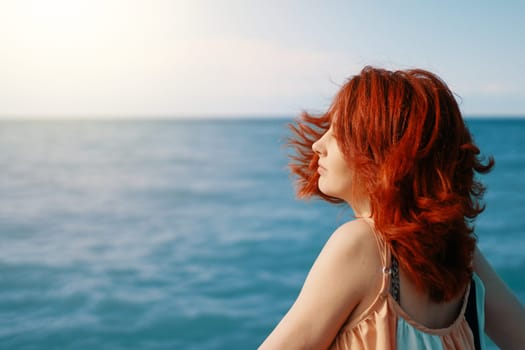 A young woman looks back on the beach against the radiant blue sea essence of a sunlit day.