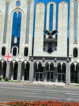 18 August 2024 Tbilisi Georgia modern building in the city center, flag. High quality photo