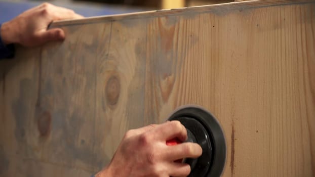 The image shows a close up of a crafted wood panel, highlighting its unique texture and rich grains. Stock Clip