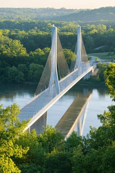 Cable-stayed bridge is reflecting in the water of the river that it crosses