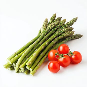 A bunch of bright green asparagus alongside several plump cherry tomatoes creates an appealing display. The fresh produce highlights healthy eating options perfect for cooking.