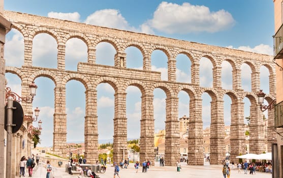 View of the Segovia aqueduct in the Azoguejo square, in Spain