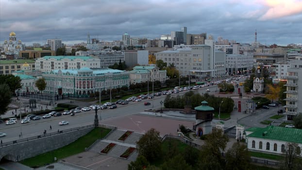 Aerial view of a cityscape with a traffic jam on the road. Stock footage. Beautiful city center