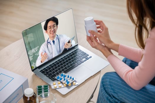 Telemedicine. Sick patient sit on sofa online consultation with doctor on laptop computer talking about illness and medication via video call at home, medical and health care technology online concept