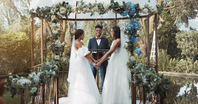 Women, lesbian wedding and ceremony outdoor with priest for love, celebration or together for commitment. Gay marriage, event and party with bride, black man or vows in nature, lgbtq couple or garden.