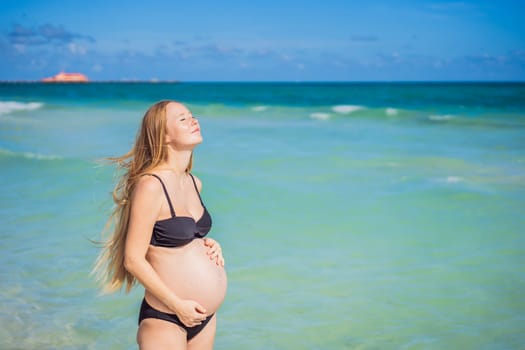 Radiant pregnant woman in a swimsuit, amid the stunning backdrop of a turquoise sea. Serene beauty of maternity by the shore.