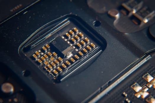 This is a detailed view of a microchip that is embedded onto a circuit board, showcasing precision engineering efforts