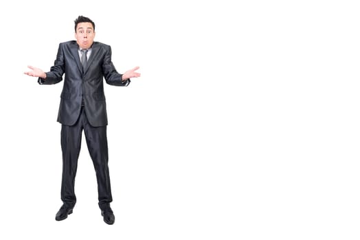 Full length of doubting male manager in suit shrugging shoulders and looking at camera on white isolated background in studio