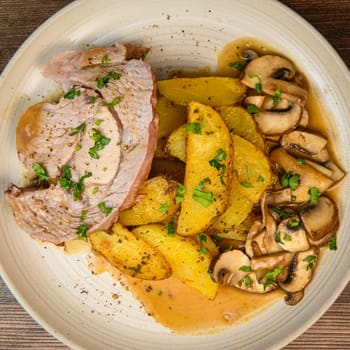 RECIPE VEAL ROAST, FRIES AND MUSHROOMS WITH SAUCE. High quality photo