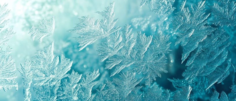 Intricate ice crystals form a mesmerizing winter landscape in shades of blue and white, showcasing nature's frozen artistry in close up detail.