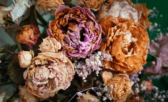 Dry bouquet. Close-up image of dried flowers in a bouquet. Life and death concept. Withered flower background