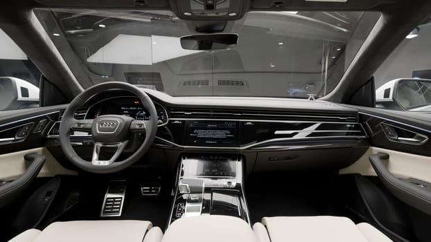 Berlin, Germany - May 19, 2022: Audi new passenger car interior. Action. Salon of a german luxury car with a steering wheel and dashboard