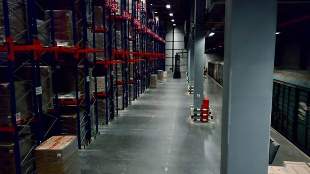 Busy work. Creative. A large warehouse room where visiting trains unload and package goods at the post office