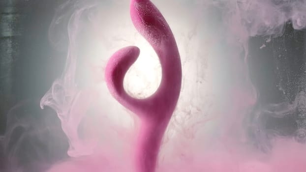 Creative work.Creative . A bright pink small slingshot on which Holly's pink colors are poured and she is dipped in them. High quality 4k footage