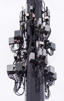 Wireless communication equipment mounted on big lightening pole. Isolated subject on white