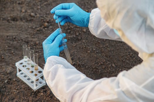 Soil analysis in a test tube. Selective focus. Nature.