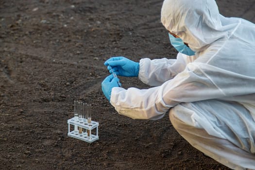 Soil analysis in a test tube. Selective focus. Nature.