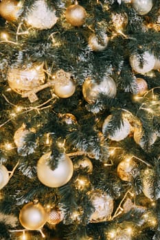 Christmas balls in close-up on the Christmas tree. Decorations for Christmas trees. The concept of celebrating New Year and Christmas