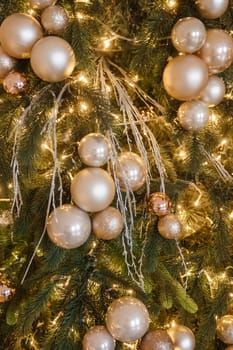 Christmas balls in close-up on the Christmas tree. Decorations for Christmas trees. The concept of celebrating New Year and Christmas