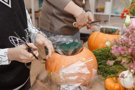 Creating a floral composition in a pumpkin. Making decor with your own hands