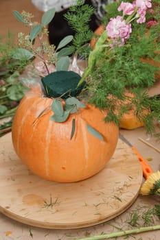 Creating a floral composition in a pumpkin. Making decor with your own hands