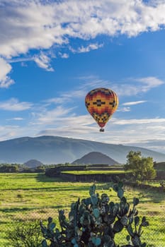 An aerial view of hot air balloons above the Teotihuacan pyramid. Adventure travel, cultural heritage, and aerial exploration concept.