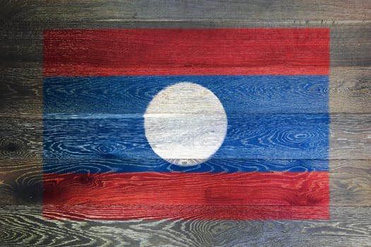 A Laos flag on rustic old wood surface background