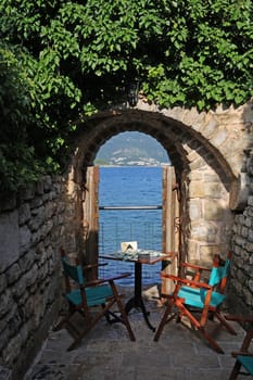 Table for two reserved for a romantic dinner with a view of the Adriatic Sea, Budva, Montenegto.