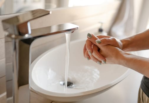Girl Washes Hands Close Up In Bathroom