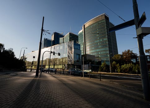 Modern Glass Building In European City Landscape At Sunset Presents Breathtaking View