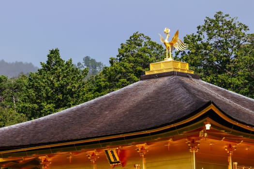 The world famous Kinkakuji Temple (The Golden Pavilion) in Kyoto, Japan on a warm autumn morning