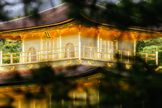 The world famous Kinkakuji Temple (The Golden Pavilion) in Kyoto, Japan on a warm autumn morning