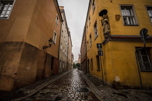 Rainy Street In The Historical Center Of Poznan, Poland, Paints A Picturesque Scene