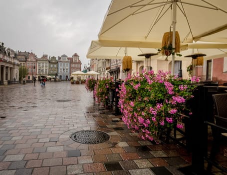 Rain Falls On Street Cafe In Poznan'S Central Square, Poland