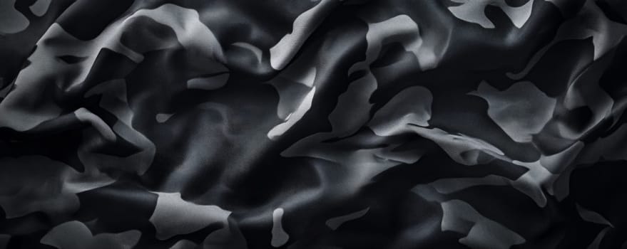 Black and gray camouflage fabric texture close-up, abstract pattern. Military and fashion concept.