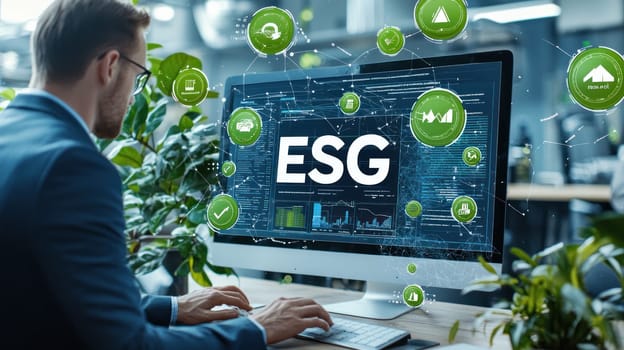 Businessman analyzing ESG data on computer surrounded by greenery, showcasing modern workspace focused on sustainability and environmental responsibility.