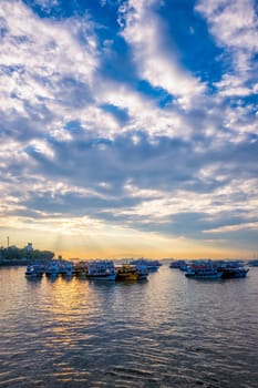 Tourist boats in sea on sunrise in Mumbai, Maharashtra, India