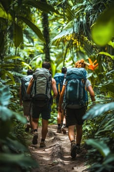 Backpackers are trekking through lush green jungle following a narrow path