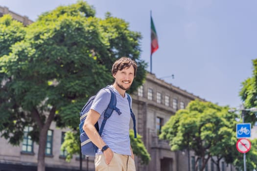 Male tourist in the central square of Mexico City, Zocalo. Cultural exploration, travel, and historic architecture concept.