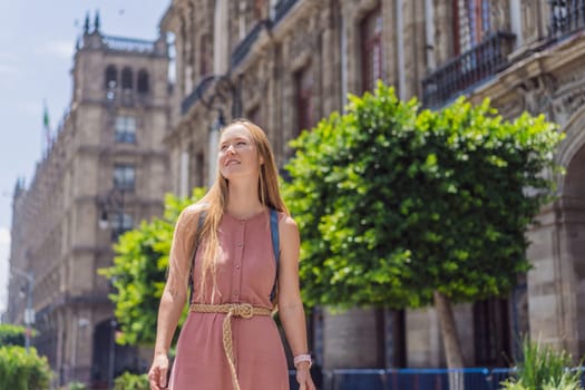 Female tourist in the central square of Mexico City, Zocalo. Cultural exploration, travel, and historic architecture concept.