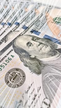 A Fan of $100 Bills.A close-up photo of a fan of $100 US dollar bills. The bills are arranged neatly, with the portrait of Benjamin Franklin visible on each bill. The background is white.Finance ve economy concept.