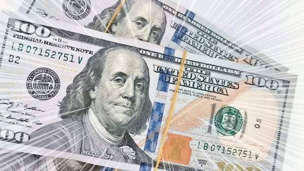 A Fan of $100 Bills.A close-up photo of a fan of $100 US dollar bills. The bills are arranged neatly, with the portrait of Benjamin Franklin visible on each bill. The background is white.Finance ve economy concept.