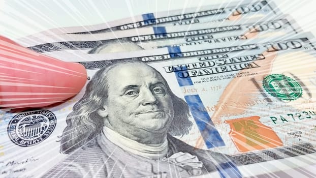 A Fan of $100 Bills.A close-up photo of a fan of $100 US dollar bills. The bills are arranged neatly, with the portrait of Benjamin Franklin visible on each bill. The background is white.Finance ve economy concept.